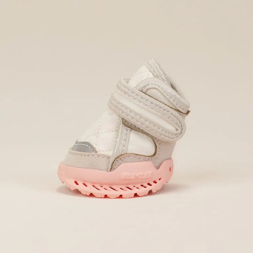 Pale dog shoe with cherry blossom pink sole and double fastening